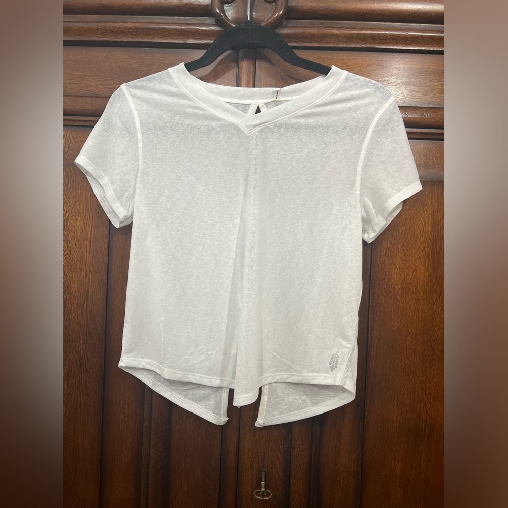 Free People Movement tee with cut outs NWOT